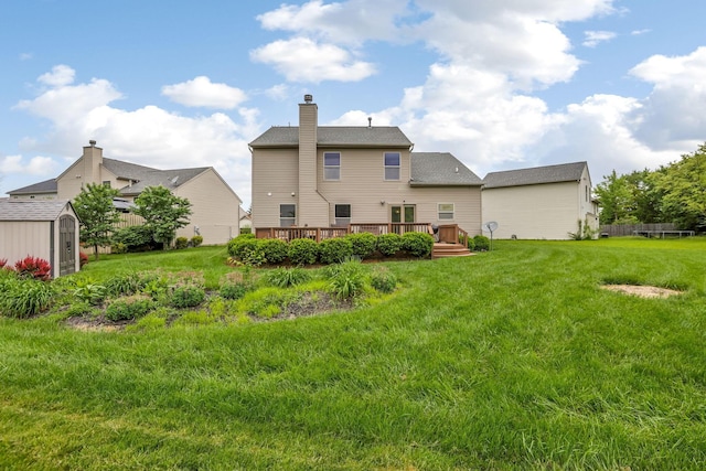 5409 Wellcrest Ct, Galloway, OH 43119 - rear view of property with a wooden deck, a lawn, and a chimney