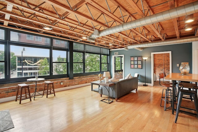 956 N High St Unit 2W, Columbus, OH 43201 - living room featuring hardwood / wood-style flooring and baseboards