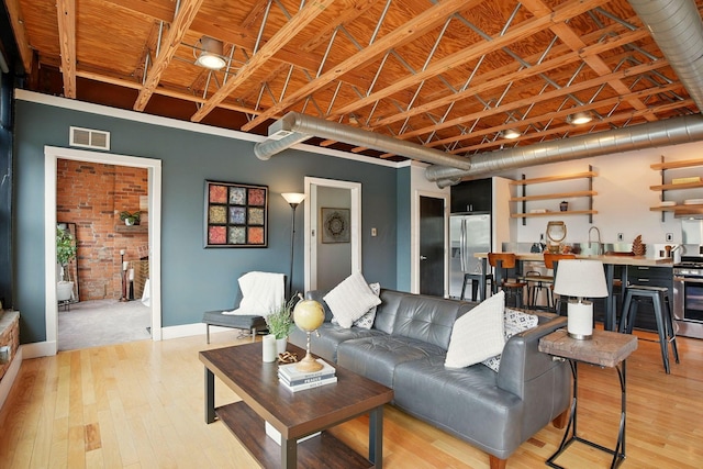 956 N High St Unit 2W, Columbus, OH 43201 - living room featuring light wood finished floors and baseboards
