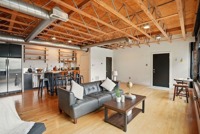 956 N High St Unit 2W, Columbus, OH 43201 - living area with light wood-style flooring and baseboards