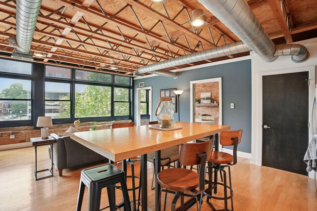956 N High St Unit 2W, Columbus, OH 43201 - dining area with light wood-type flooring and baseboards