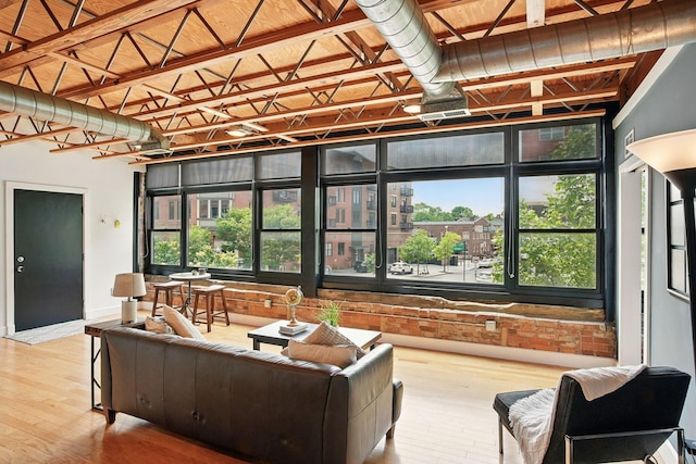 956 N High St Unit 2W, Columbus, OH 43201 - living area with wood-type flooring and healthy amount of natural light