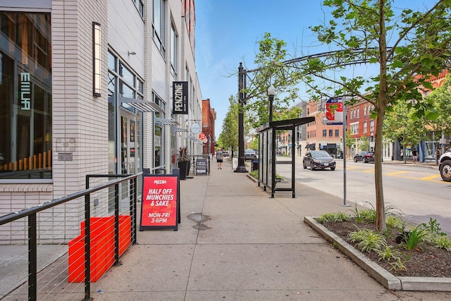 956 N High St Unit 2W, Columbus, OH 43201 - view of asphalt street with sidewalks, curbs, street lighting, and traffic signs