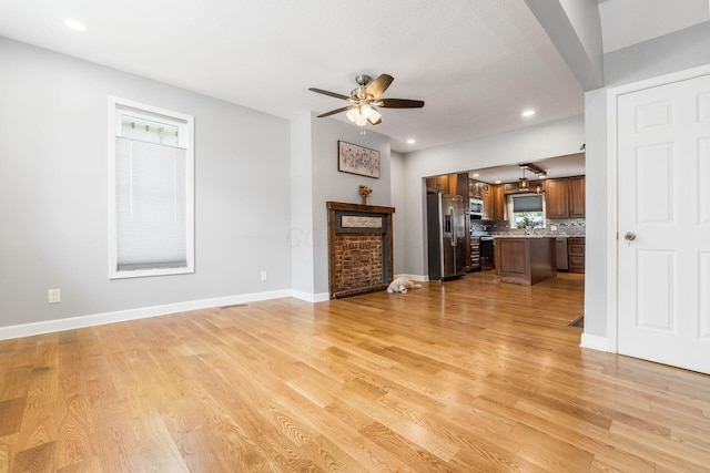 71 Market St, Carroll, OH 43112 - unfurnished living room with a ceiling fan, light wood-style floors, baseboards, and recessed lighting