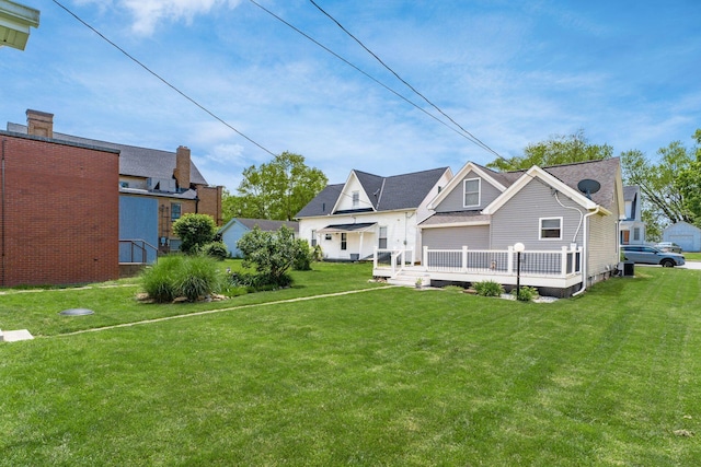 71 Market St, Carroll, OH 43112 - back of property with a lawn and a wooden deck