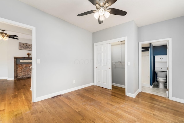 71 Market St, Carroll, OH 43112 - unfurnished bedroom featuring light wood finished floors, baseboards, a closet, a ceiling fan, and ensuite bathroom