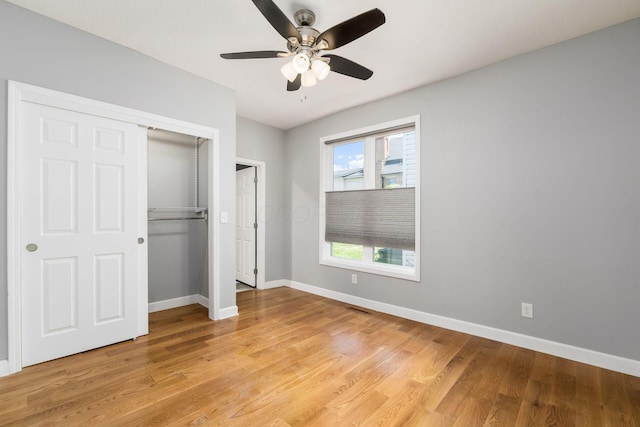 71 Market St, Carroll, OH 43112 - unfurnished bedroom featuring a closet, baseboards, light wood-type flooring, and a ceiling fan
