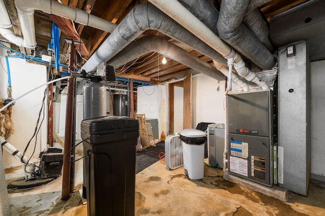 71 Market St, Carroll, OH 43112 - unfinished below grade area with heating unit, water heater, and a water softener system