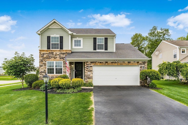 21 Mandolin Ct, Etna, OH 43062 - traditional-style house with stone siding, asphalt driveway, a front lawn, and roof with shingles