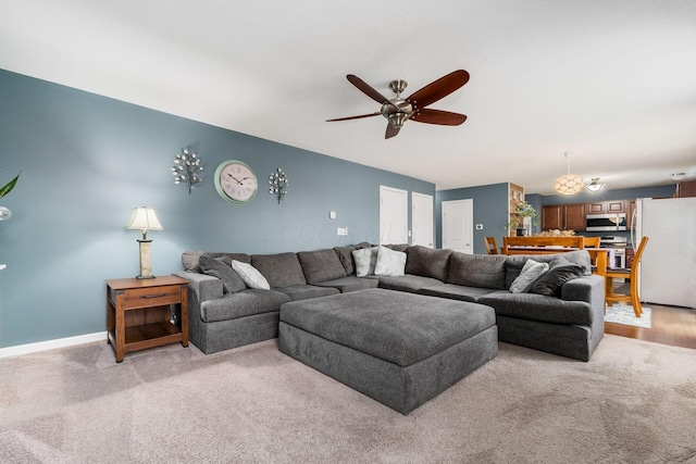 21 Mandolin Ct, Etna, OH 43062 - living room featuring light carpet, ceiling fan, and baseboards
