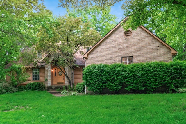 248 Academy Woods Dr, Columbus, OH 43230 - view of front of home with a front yard and brick siding