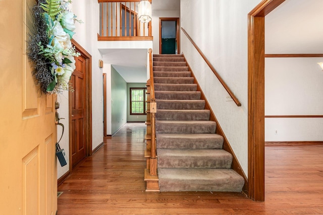 248 Academy Woods Dr, Columbus, OH 43230 - entryway with wood finished floors, stairway, and baseboards