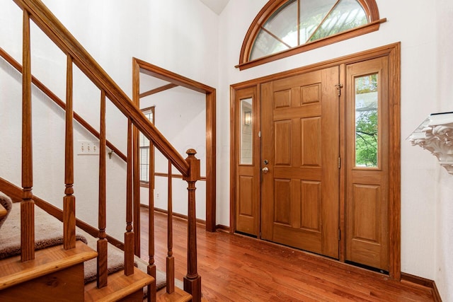 248 Academy Woods Dr, Columbus, OH 43230 - foyer featuring wood finished floors, stairs, and baseboards