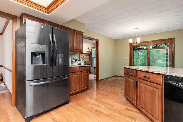 248 Academy Woods Dr, Columbus, OH 43230 - kitchen featuring fridge with ice dispenser, dishwasher, light wood-style floors, and brown cabinets