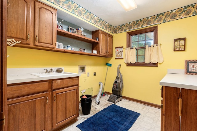 248 Academy Woods Dr, Columbus, OH 43230 - laundry area featuring hookup for an electric dryer, hookup for a washing machine, cabinet space, light floors, and baseboards