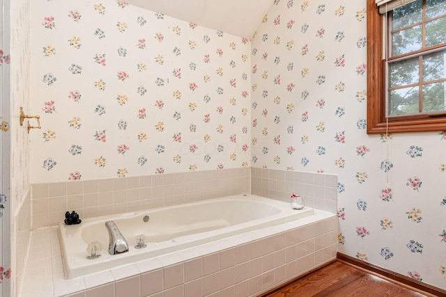 248 Academy Woods Dr, Columbus, OH 43230 - full bath with wallpapered walls, wood finished floors, a bath, baseboards, and vaulted ceiling