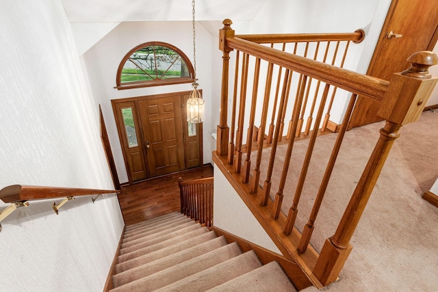 248 Academy Woods Dr, Columbus, OH 43230 - stairway with wood finished floors and high vaulted ceiling