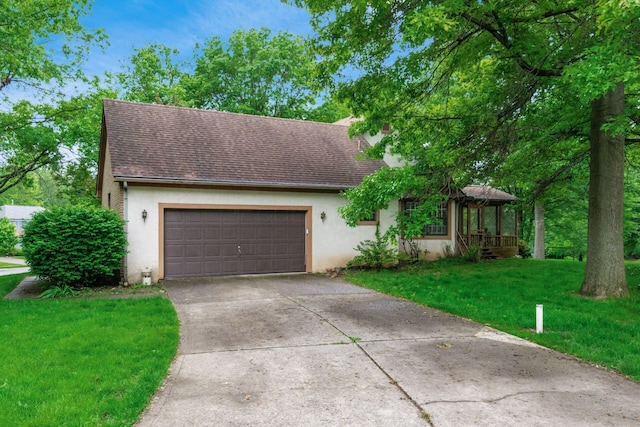 248 Academy Woods Dr, Columbus, OH 43230 - view of front facade featuring stucco siding, roof with shingles, an attached garage, a front yard, and driveway
