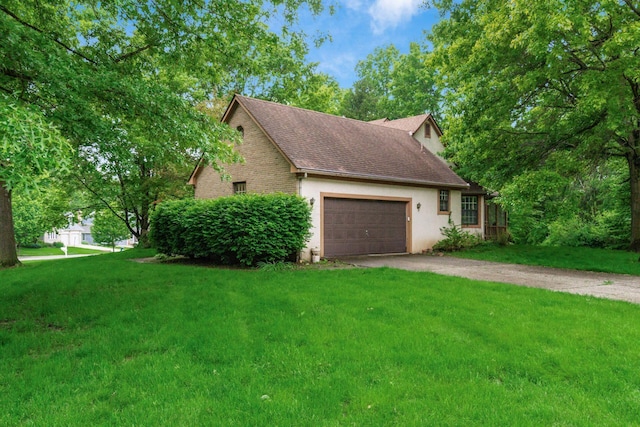 248 Academy Woods Dr, Columbus, OH 43230 - view of side of property featuring driveway, a garage, a lawn, a shingled roof, and stucco siding