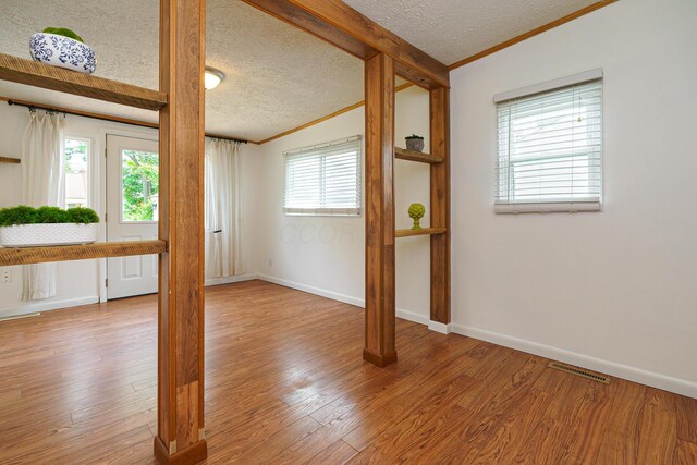 68 N Broadleigh Rd, Columbus, OH 43209 - spare room with ornamental molding, a textured ceiling, and wood finished floors