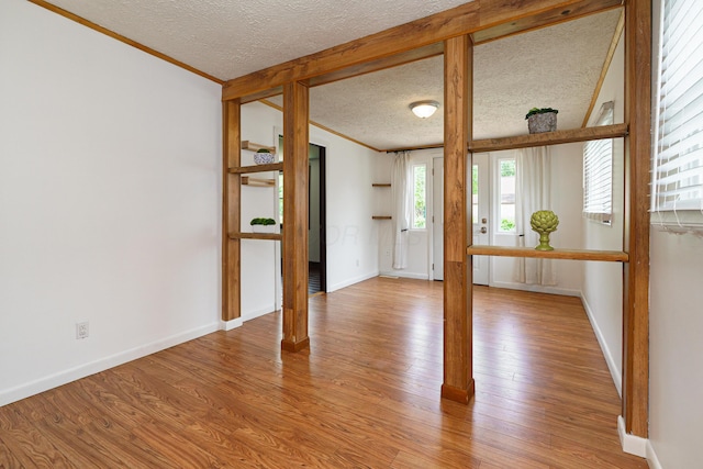 68 N Broadleigh Rd, Columbus, OH 43209 - unfurnished room with ornamental molding, a textured ceiling, and light wood finished floors