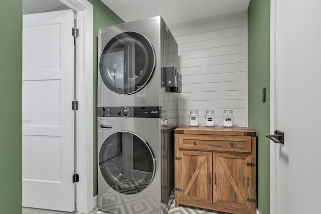 9556 Ireland Ct, Powell, OH 43065 - laundry room featuring stacked washer and clothes dryer