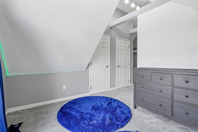 9556 Ireland Ct, Powell, OH 43065 - bedroom with vaulted ceiling, carpet flooring, and baseboards