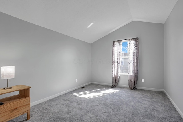 9556 Ireland Ct, Powell, OH 43065 - unfurnished bedroom with carpet flooring, vaulted ceiling, and baseboards