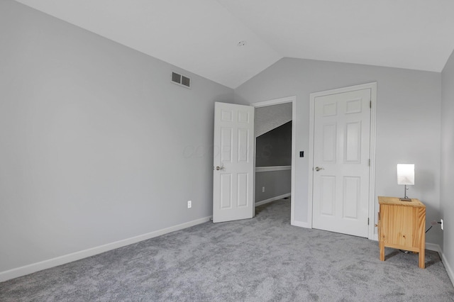 9556 Ireland Ct, Powell, OH 43065 - unfurnished bedroom with vaulted ceiling, carpet floors, and baseboards