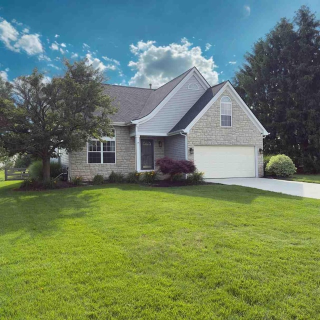 9556 Ireland Ct, Powell, OH 43065 - ranch-style home with stone siding, concrete driveway, a front yard, a garage, and roof with shingles