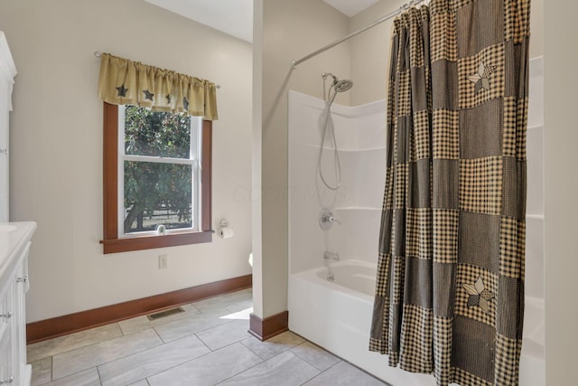 22119 State Route 104, Circleville, OH 43113 - bathroom with shower / bath combo, baseboards, tile patterned flooring, and vanity