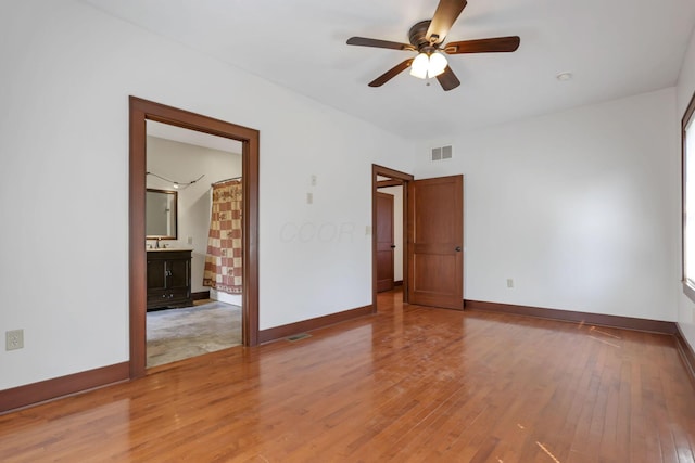 22119 State Route 104, Circleville, OH 43113 - empty room featuring light wood-style floors, ceiling fan, and baseboards