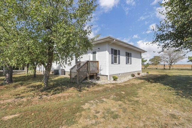 22119 State Route 104, Circleville, OH 43113 - view of home's exterior featuring a lawn and crawl space