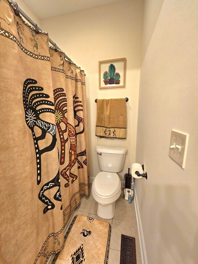 8701 Creekwood Pl, Canal Winchester, OH 43110 - full bathroom featuring tile patterned floors, baseboards, toilet, and a shower with curtain