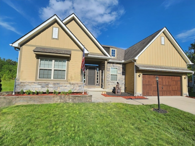 8701 Creekwood Pl, Canal Winchester, OH 43110 - craftsman-style home featuring stone siding, driveway, board and batten siding, and a front yard