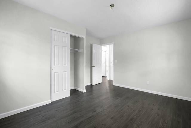 2751 Baker Ave, Cincinnati, OH 45211 - unfurnished bedroom with dark wood finished floors, baseboards, and a closet