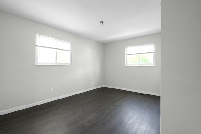 2751 Baker Ave, Cincinnati, OH 45211 - spare room featuring baseboards and dark wood finished floors