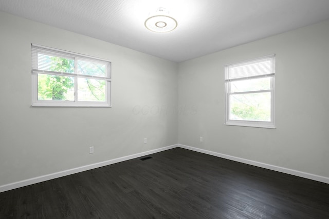 2751 Baker Ave, Cincinnati, OH 45211 - unfurnished room with plenty of natural light, dark wood-style floors, and baseboards