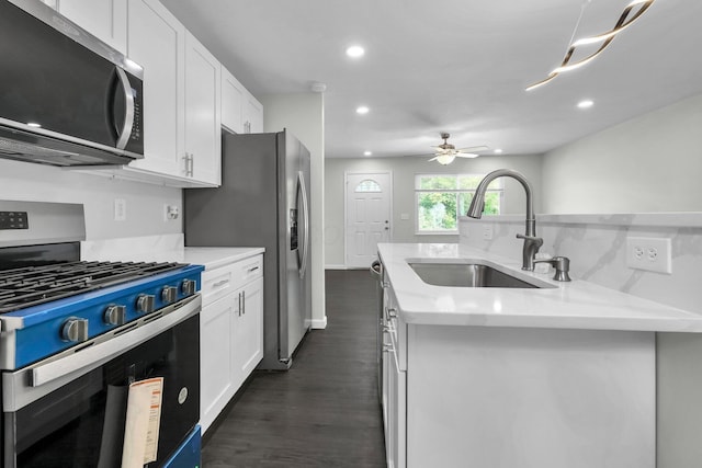 2751 Baker Ave, Cincinnati, OH 45211 - kitchen featuring appliances with stainless steel finishes, a sink, dark wood finished floors, recessed lighting, and white cabinets