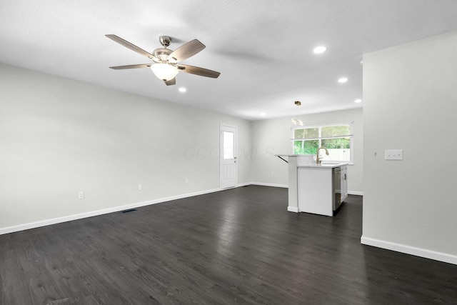 2751 Baker Ave, Cincinnati, OH 45211 - empty room with dark wood finished floors, a ceiling fan, baseboards, recessed lighting, and a sink
