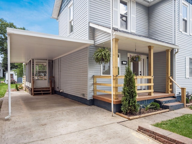 179 Boyleston Ave, Newark, OH 43055 - property entrance featuring concrete driveway, a carport, and covered porch