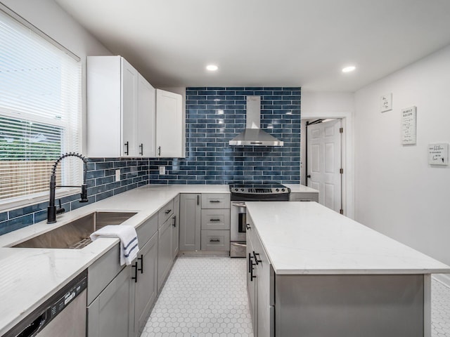 179 Boyleston Ave, Newark, OH 43055 - kitchen featuring extractor fan, appliances with stainless steel finishes, decorative backsplash, a kitchen island, and light stone countertops