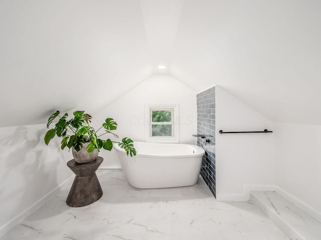 179 Boyleston Ave, Newark, OH 43055 - full bath with a freestanding bath, vaulted ceiling, and marble finish flooring