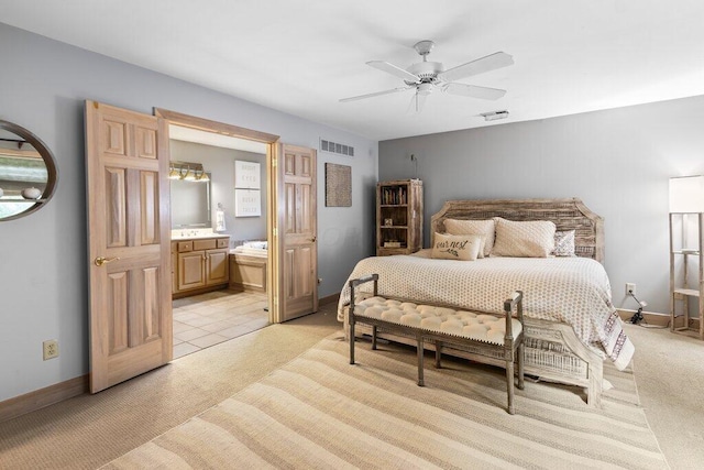 4367 Tavistock Cir, Powell, OH 43065 - bedroom with light carpet, ensuite bath, baseboards, and ceiling fan