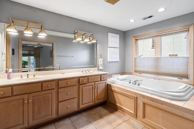4367 Tavistock Cir, Powell, OH 43065 - bathroom with double vanity, tile patterned floors, a bath, and recessed lighting