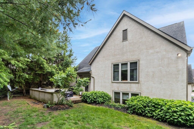 4367 Tavistock Cir, Powell, OH 43065 - view of property exterior with roof with shingles, stucco siding, and a yard