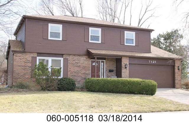 7121 Briarcliff Rd, Reynoldsburg, OH 43068 - traditional home with brick siding, driveway, and a front yard
