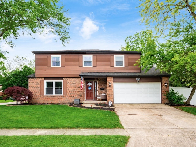 7121 Briarcliff Rd, Reynoldsburg, OH 43068 - view of front facade featuring brick siding, an attached garage, and concrete driveway