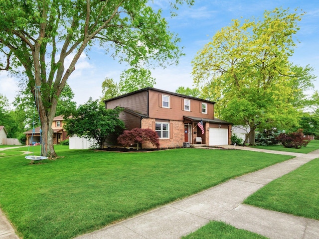 7121 Briarcliff Rd, Reynoldsburg, OH 43068 - view of front of property with concrete driveway, brick siding, a front lawn, and a garage