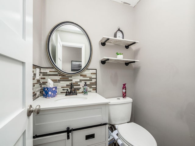 7121 Briarcliff Rd, Reynoldsburg, OH 43068 - half bathroom featuring decorative backsplash, toilet, and vanity